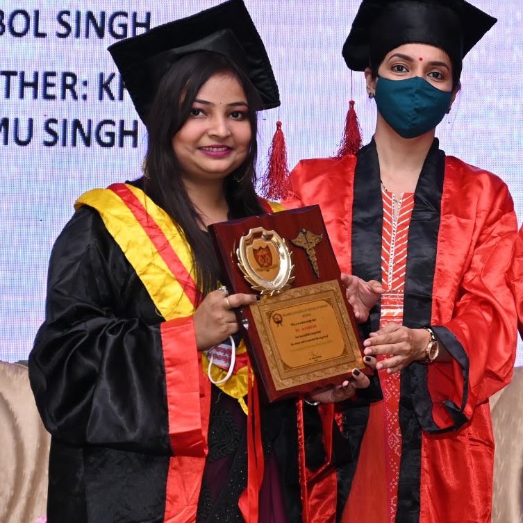 Dr. Kasish Choudhary receiving an award